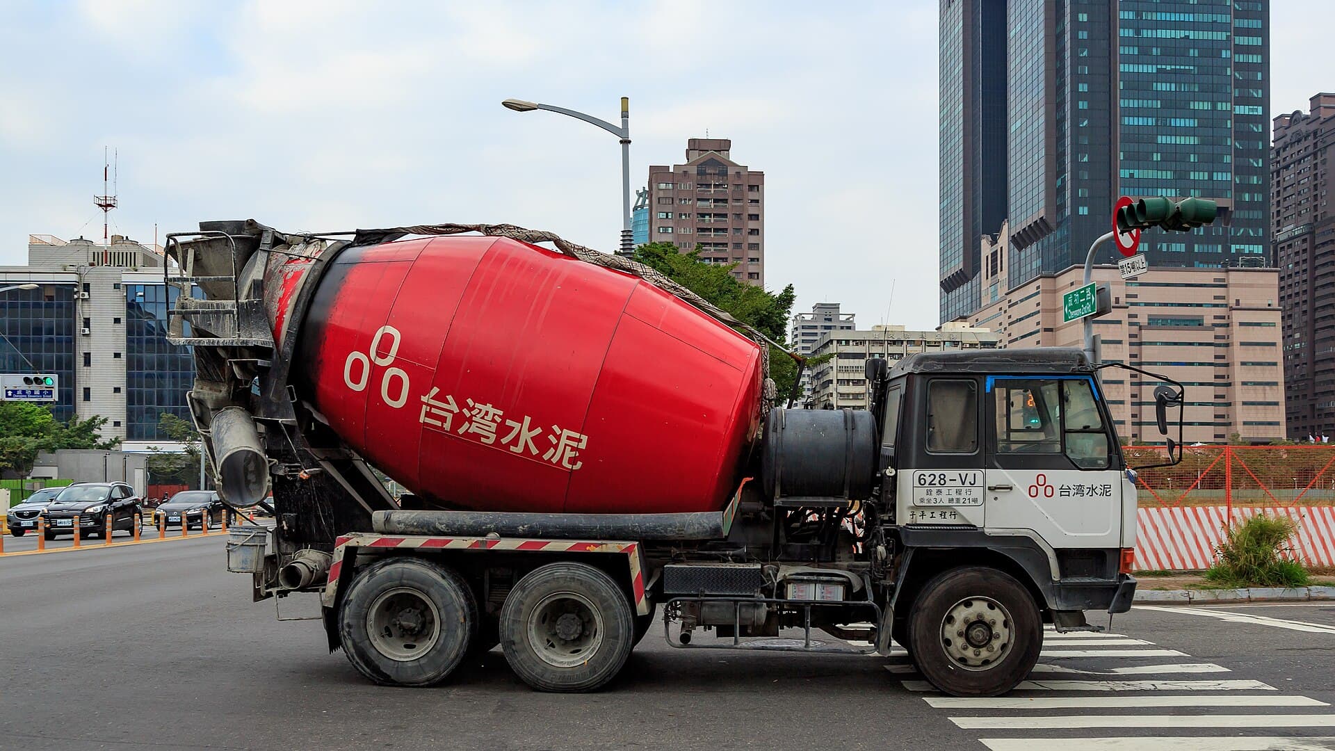 Rear-discharge concrete mixer truck on a construction site