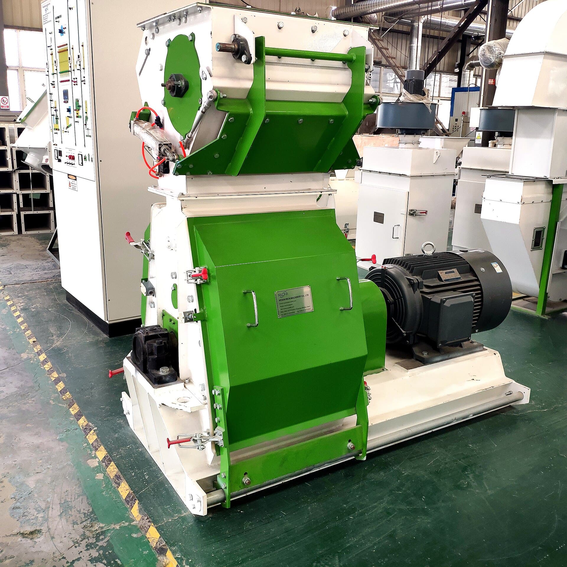 Industrial hammer mill on a factory floor ready for gold-ore duty