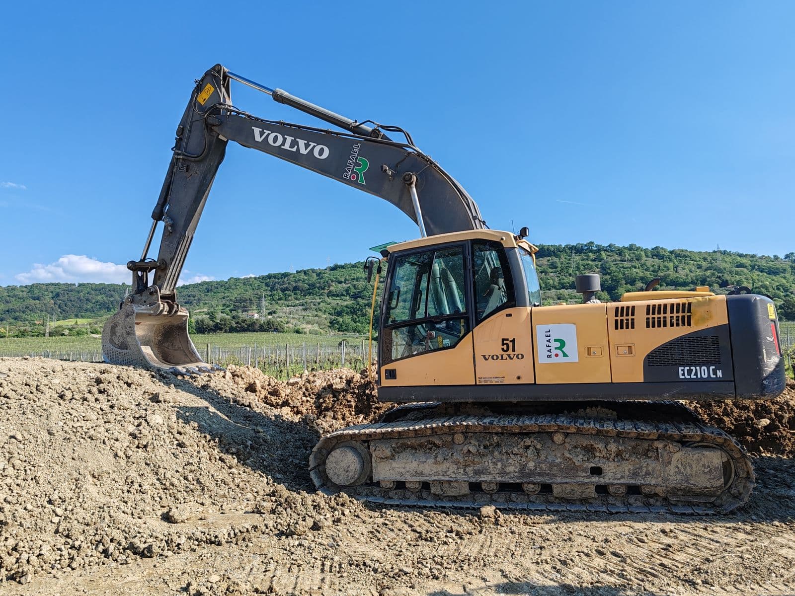 Tracked hydraulic excavator digging on a construction and mining site